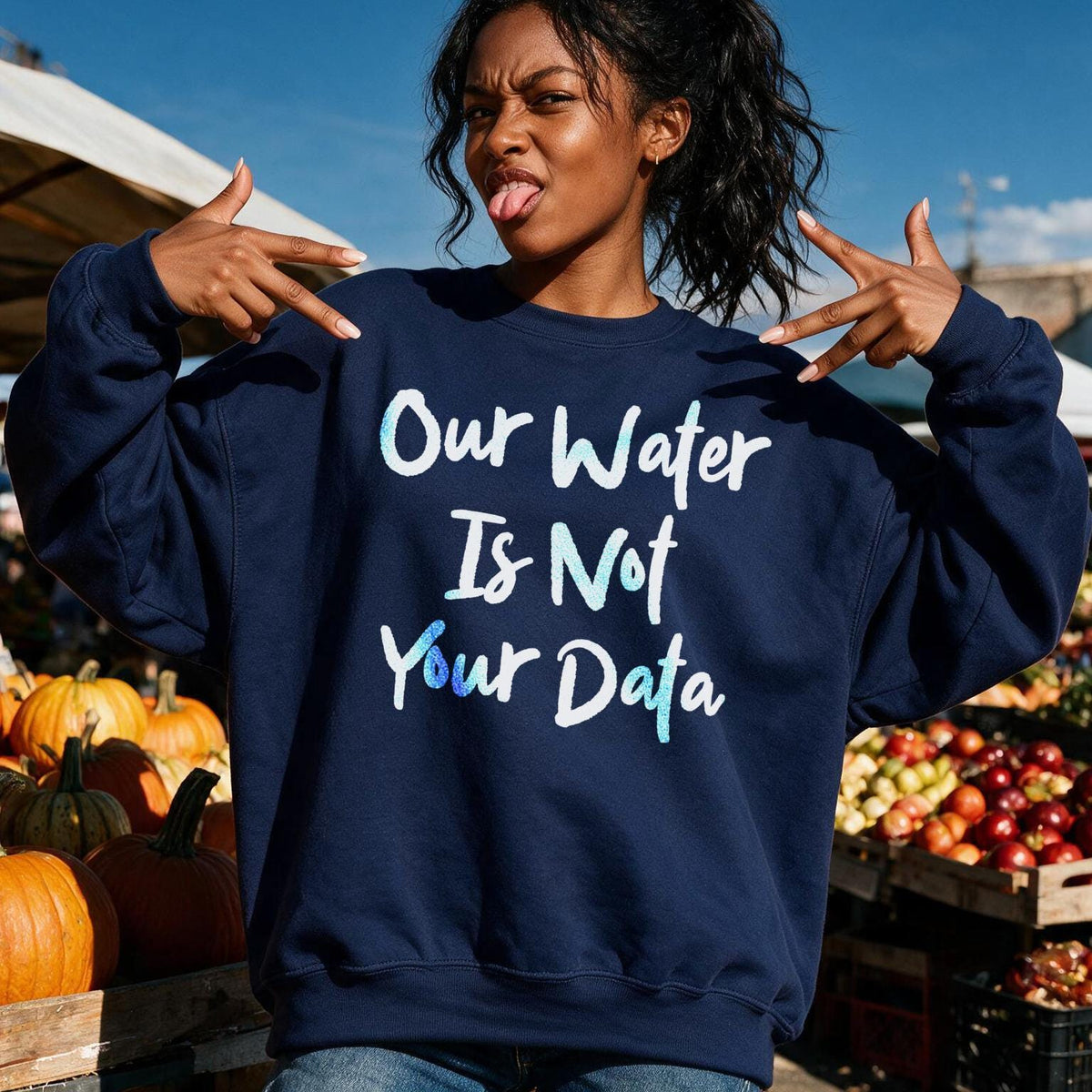 Navy sweatshirt with &amp;quot;Our Water Is Not Your Data&amp;quot; text, modeled outdoors.