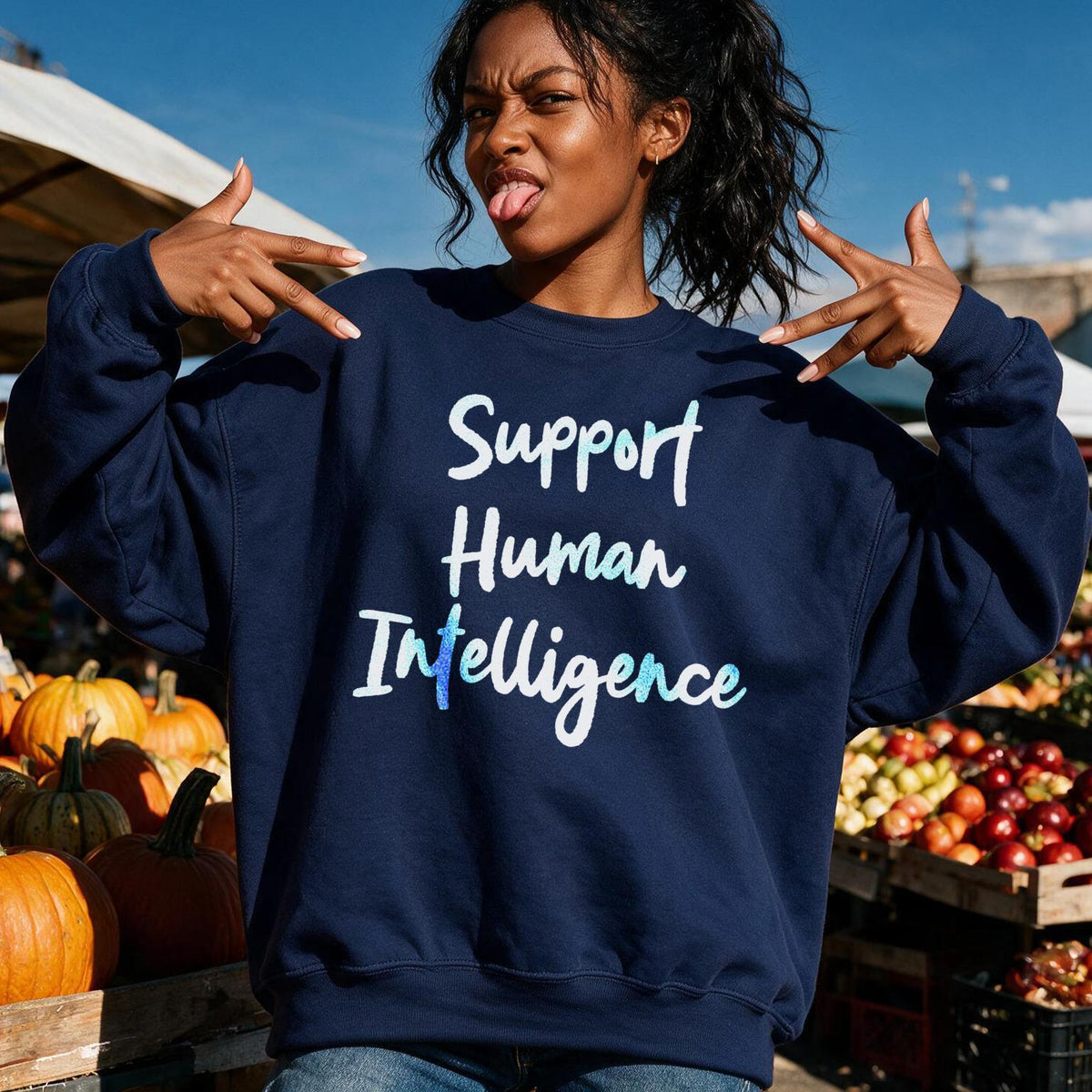 Navy sweatshirt with &amp;quot;Support Human Intelligence&amp;quot; text, featuring a woman at a market.