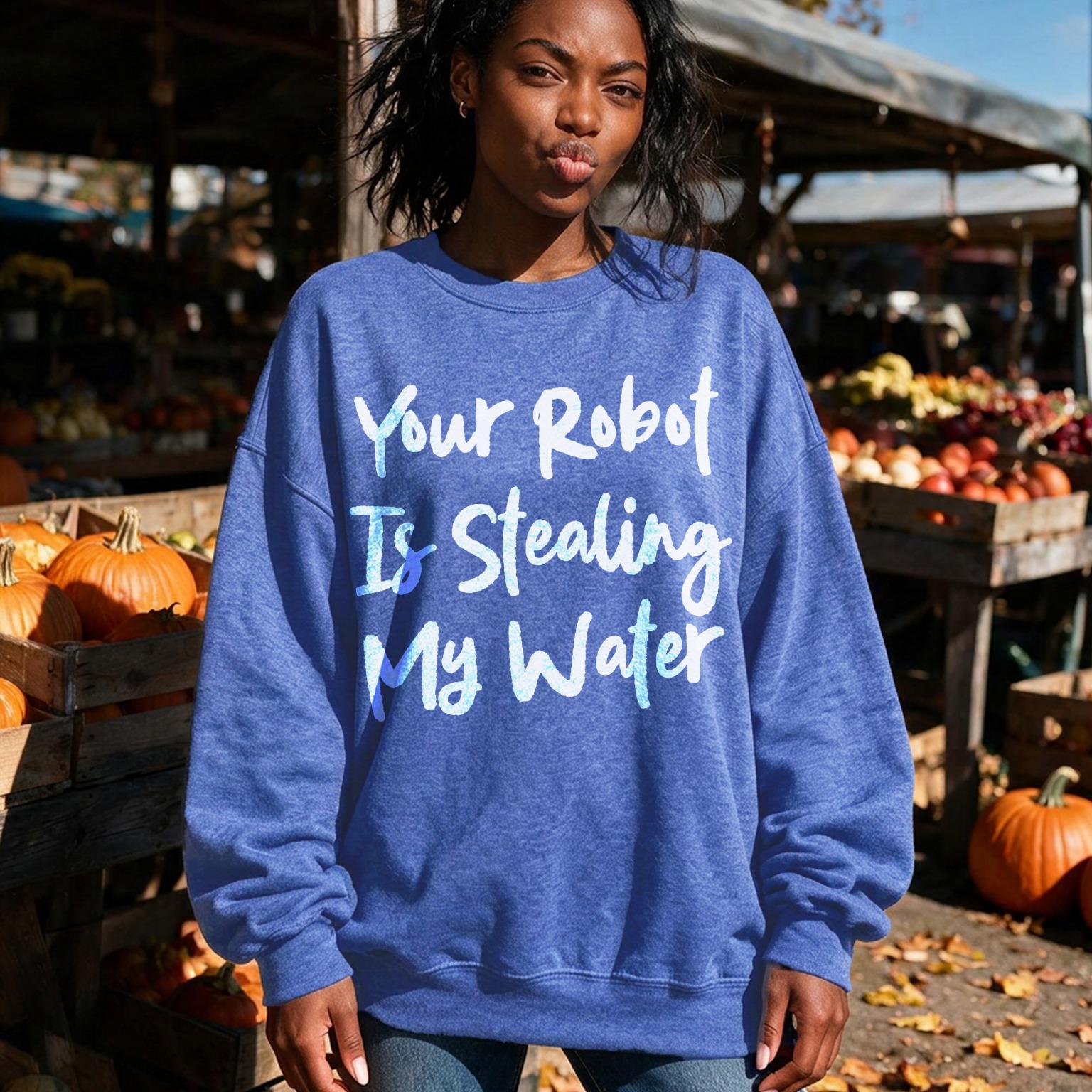 Woman in blue sweatshirt with text &amp;quot;Your Robot Is Stealing My Water.&amp;quot;