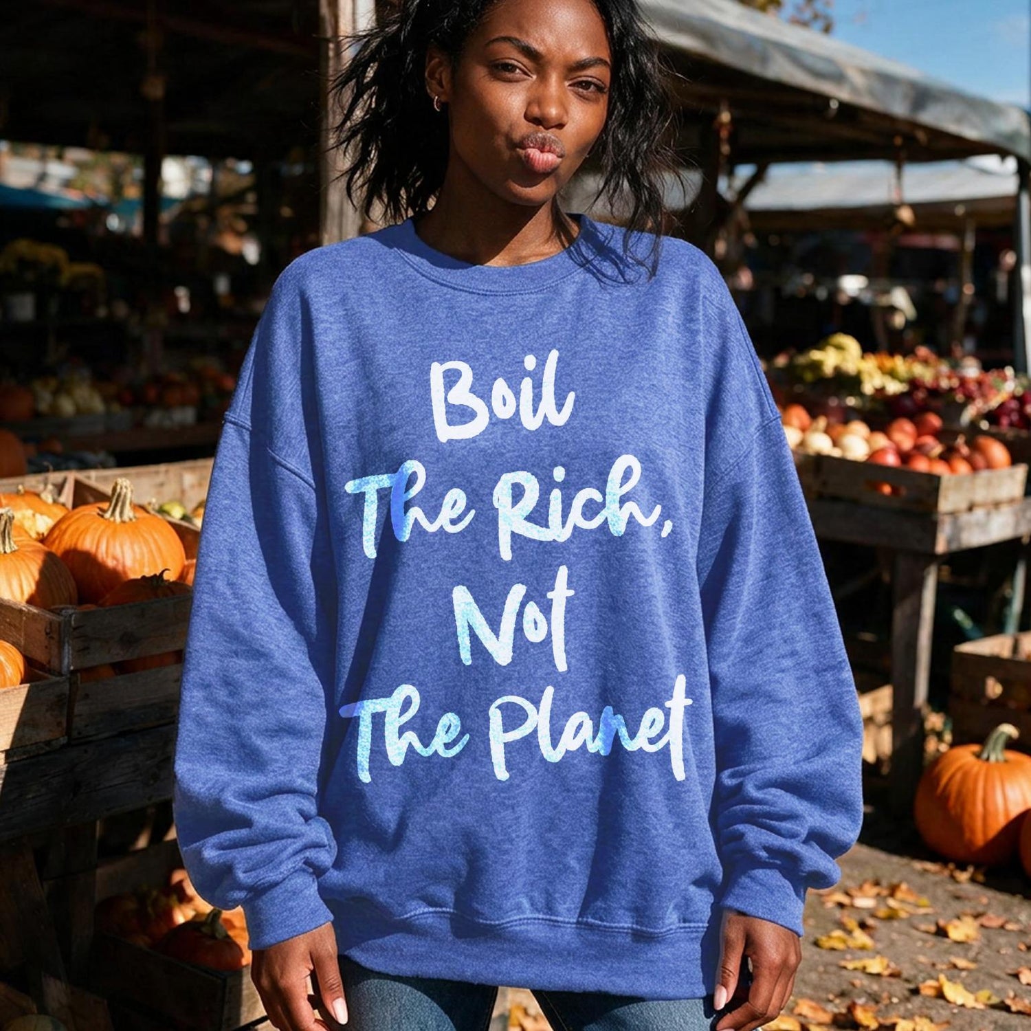 Blue sweatshirt with white text &amp;quot;Boil the Rich, Not the Planet&amp;quot;.