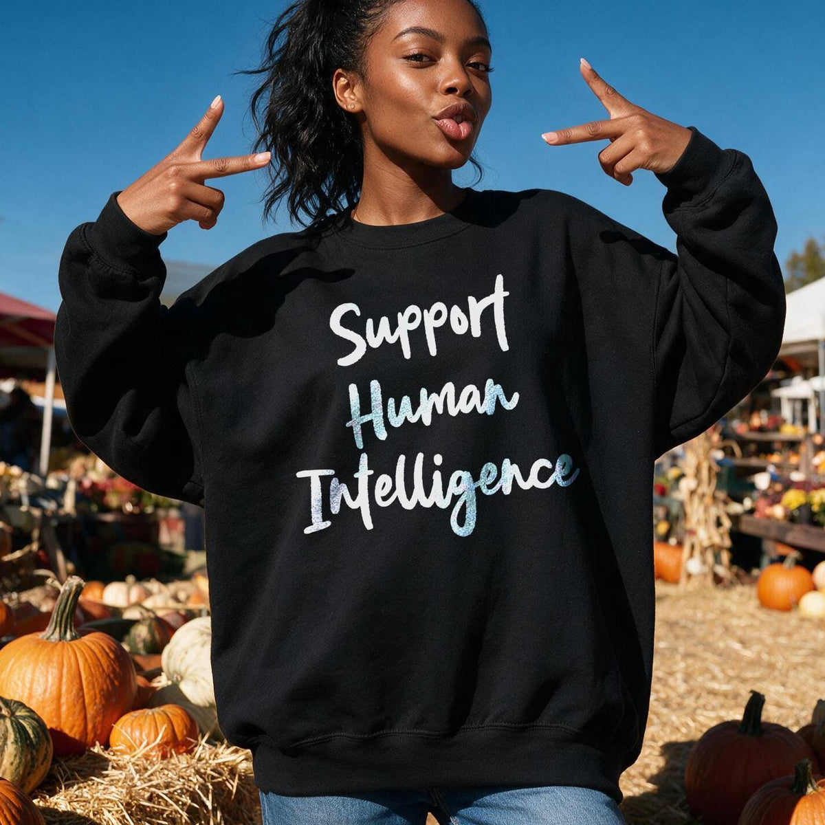 Black sweatshirt with &amp;quot;Support Human Intelligence&amp;quot; text, worn by a woman outdoors.