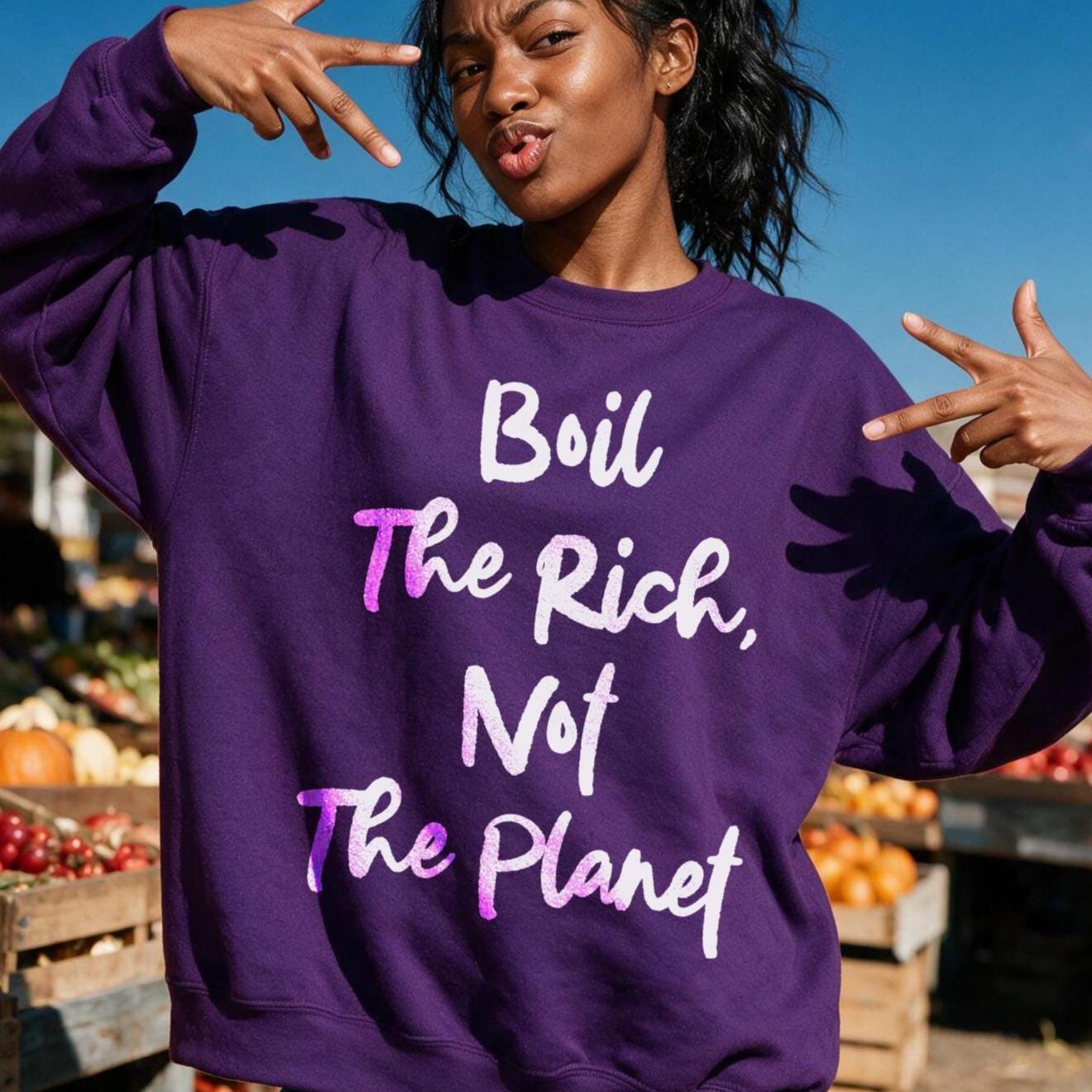 Purple sweatshirt with &amp;quot;Boil The Rich, Not The Planet&amp;quot; text.
