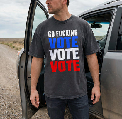Man wearing dark t-shirt with &amp;quot;GO FUCKING VOTE VOTE VOTE&amp;quot; text.