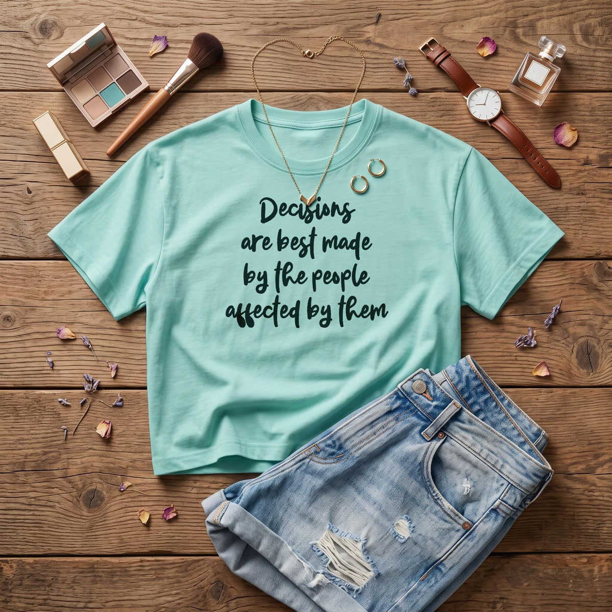 Teal t-shirt with text &amp;quot;Decisions are best made by the people affected by them.&amp;quot;