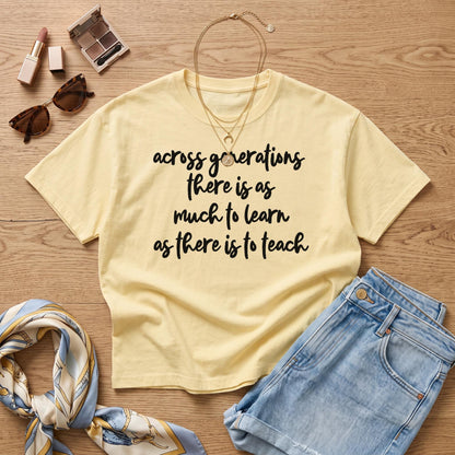 Yellow t-shirt with black text &amp;quot;Across generations there is as much to learn as there is to teach&amp;quot;.