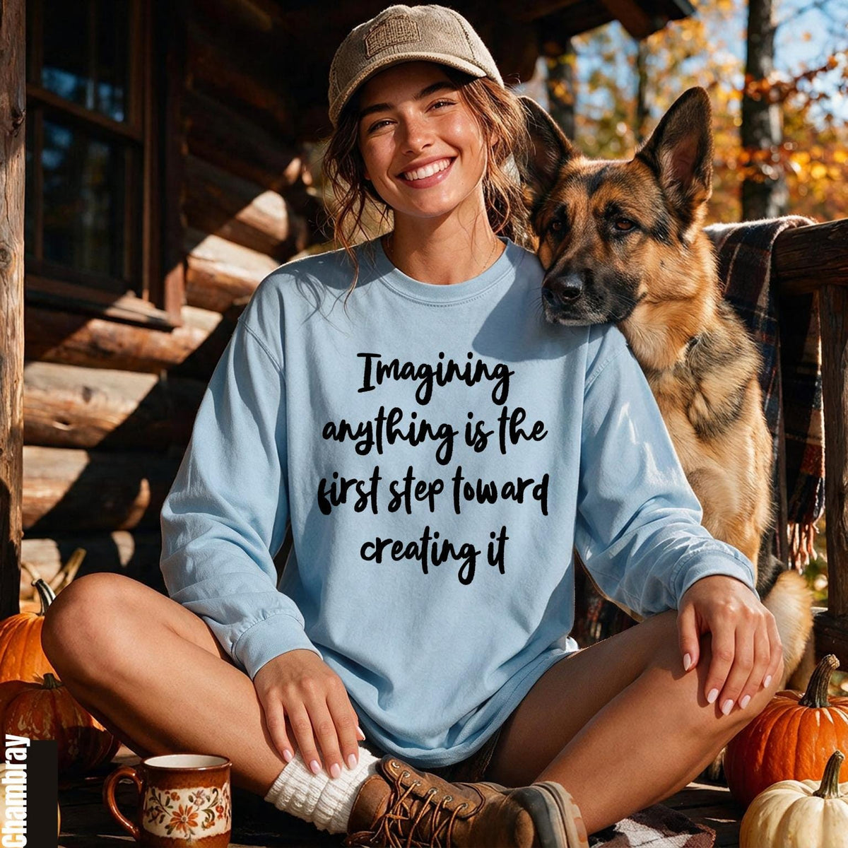 Light blue long-sleeve shirt with quote &amp;quot;Imagining anything is the first step toward creating it.&amp;quot;