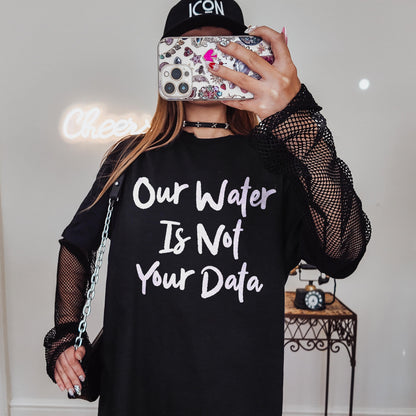 Black long-sleeve shirt with &amp;quot;Our Water Is Not Your Data&amp;quot; text and fishnet sleeves.