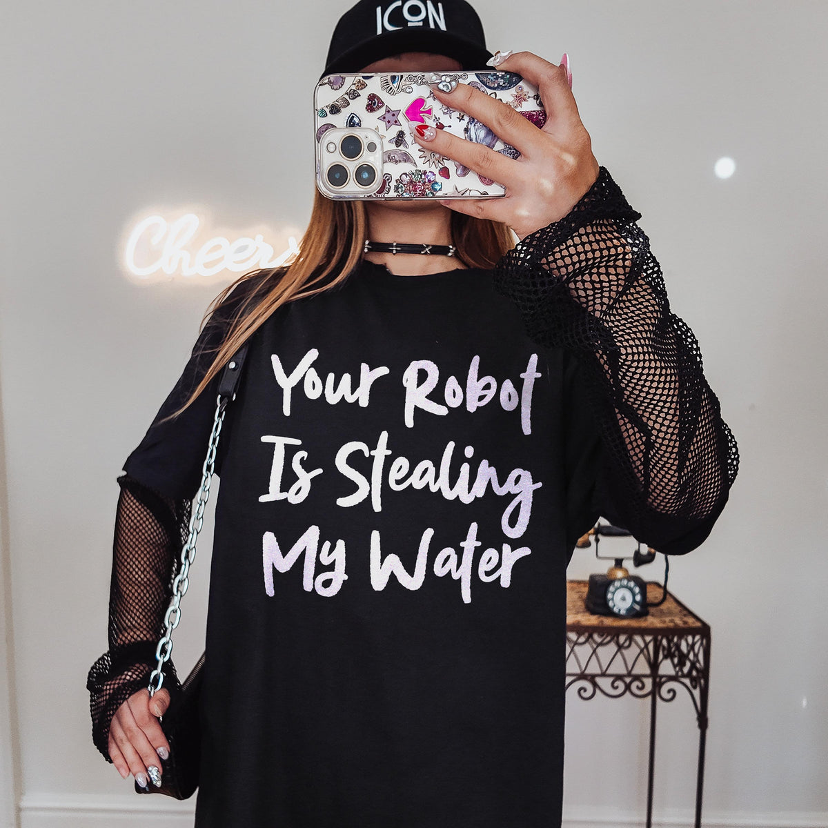 Black t-shirt with &amp;quot;Your Robot Is Stealing My Water&amp;quot; text and fishnet sleeves.