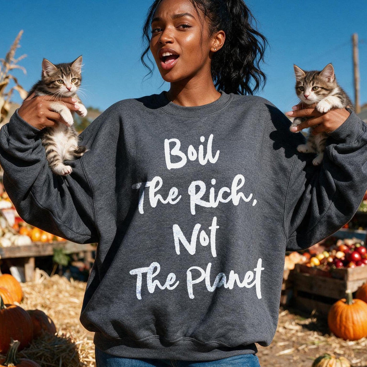 Woman in dark sweatshirt holding two kittens, text reads &amp;quot;Boil the Rich, Not the Planet&amp;quot;.