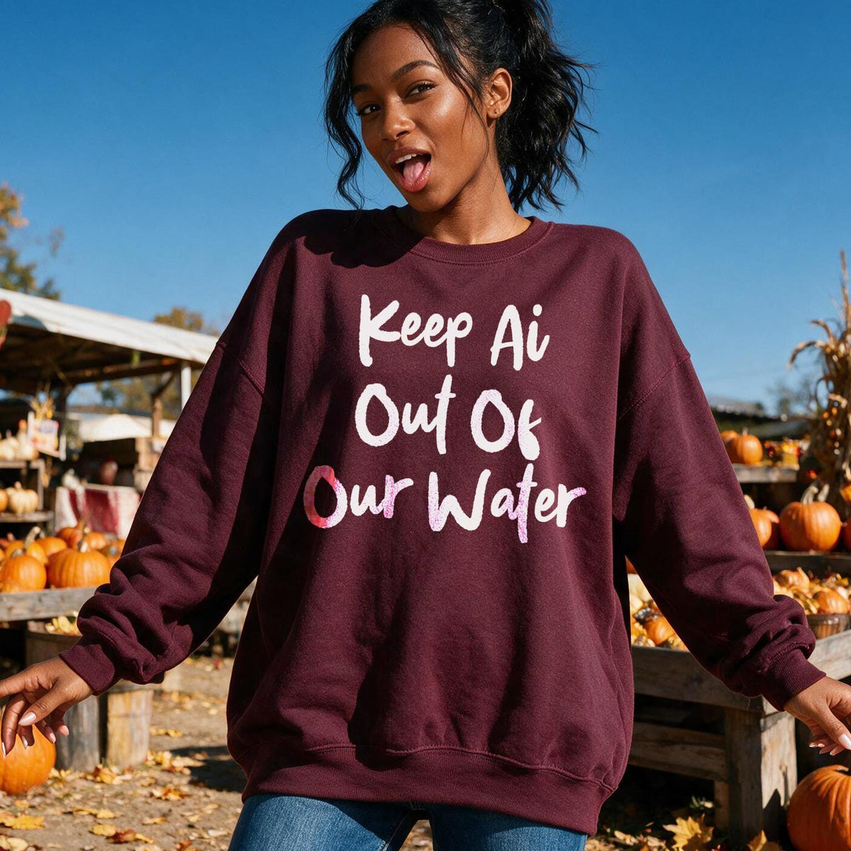 Maroon sweatshirt with text &amp;quot;Keep Ai Out Of Our Water&amp;quot; on a young woman.