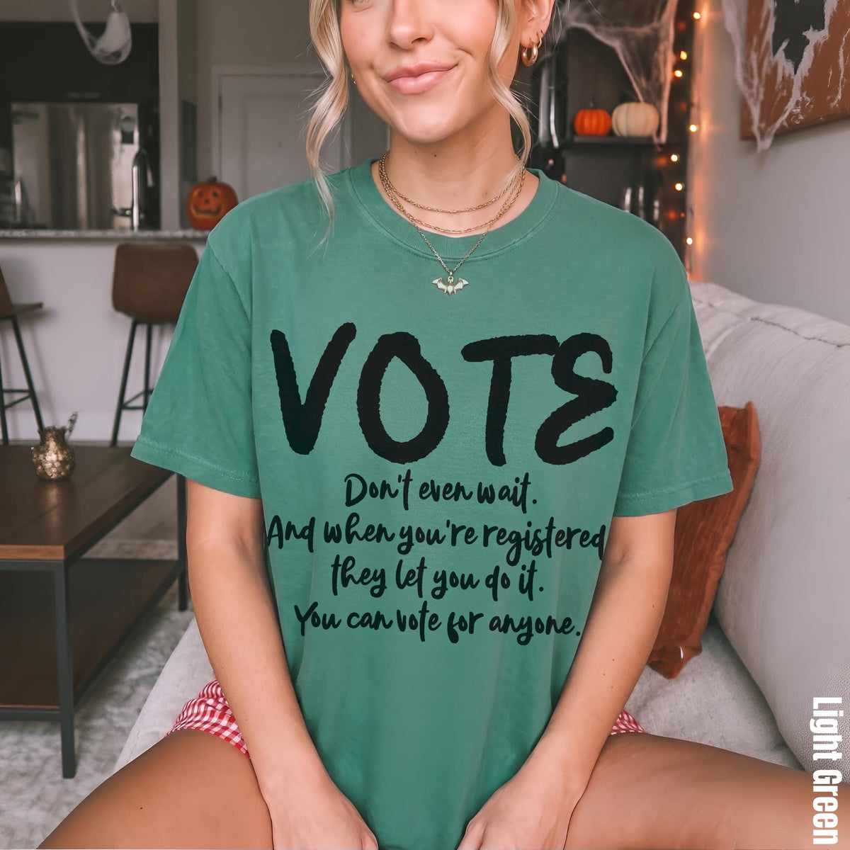 Green t-shirt with &amp;quot;VOTE&amp;quot; and voting encouragement text.