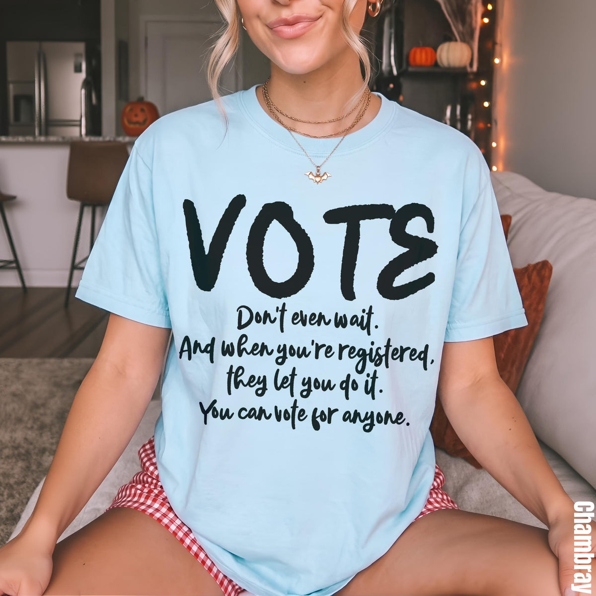 Light blue t-shirt with &amp;quot;VOTE&amp;quot; and voting encouragement text.