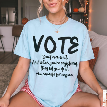 Light blue t-shirt with &amp;quot;VOTE&amp;quot; and voting encouragement text.
