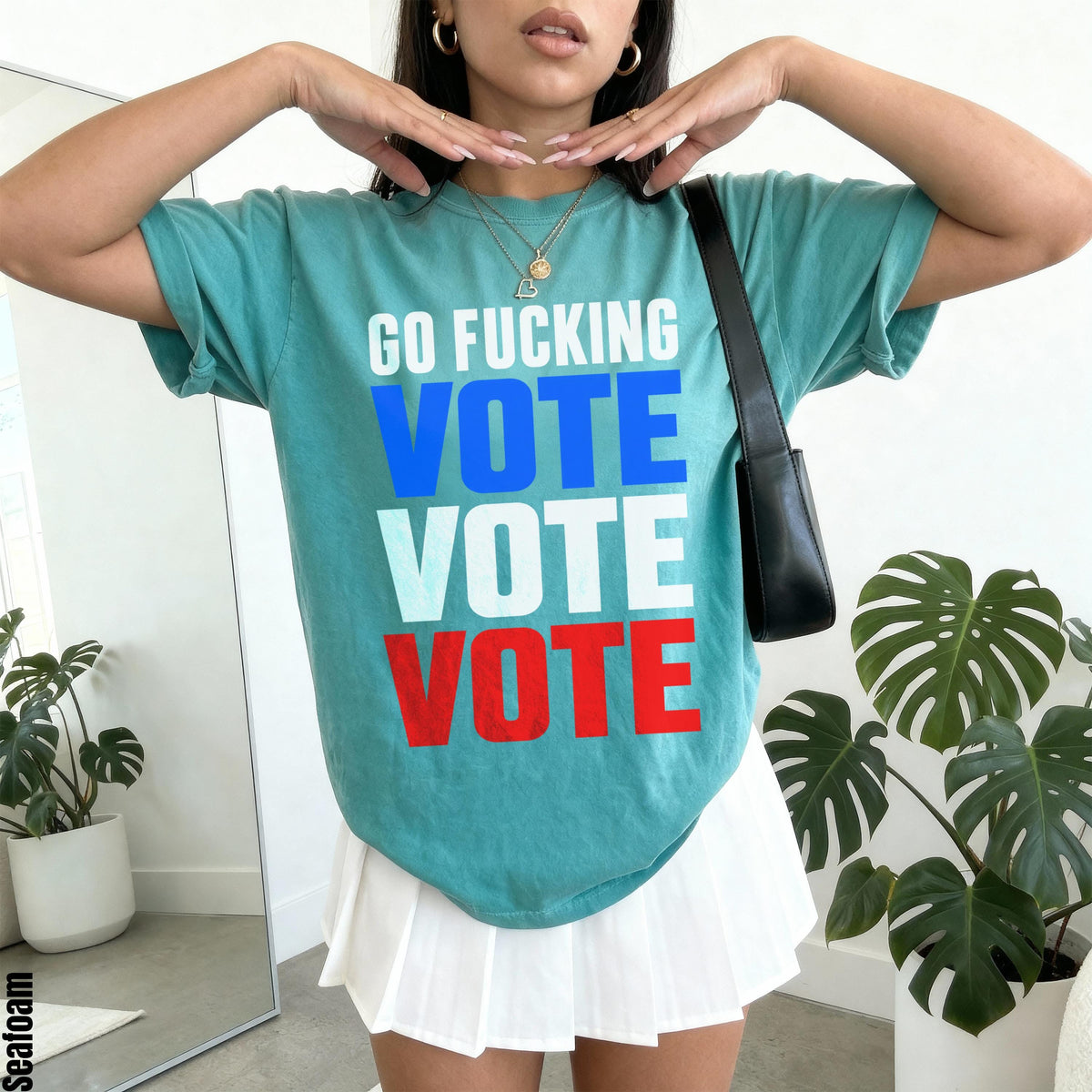 Teal t-shirt with &amp;quot;GO F***ING VOTE VOTE VOTE&amp;quot; text in white, blue, and red.