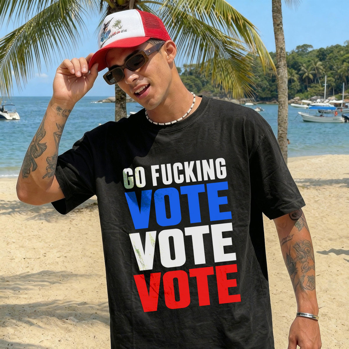 Man wearing black t-shirt with &amp;quot;GO F***ING VOTE VOTE VOTE&amp;quot; text on beach.