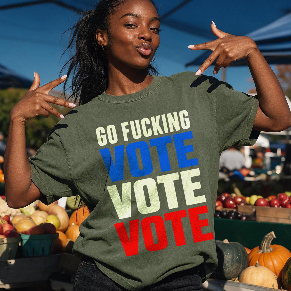 Woman wearing green t-shirt with &amp;quot;GO FUCKING VOTE&amp;quot; text in patriotic colors.