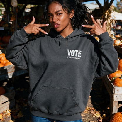 Woman wearing dark grey hoodie with white &amp;quot;VOTE 
