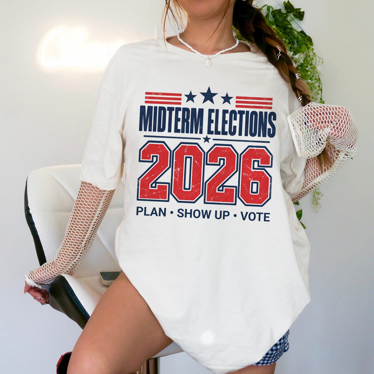 White t-shirt with &amp;quot;Midterm Elections 2026 Plan Show Up Vote&amp;quot; text.