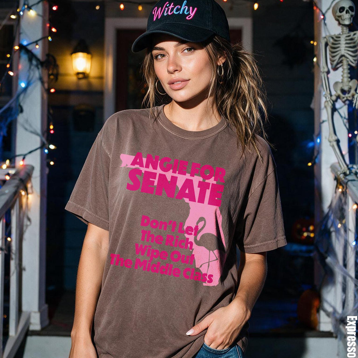 Woman wearing a brown t-shirt with pink text and flamingo graphic.
