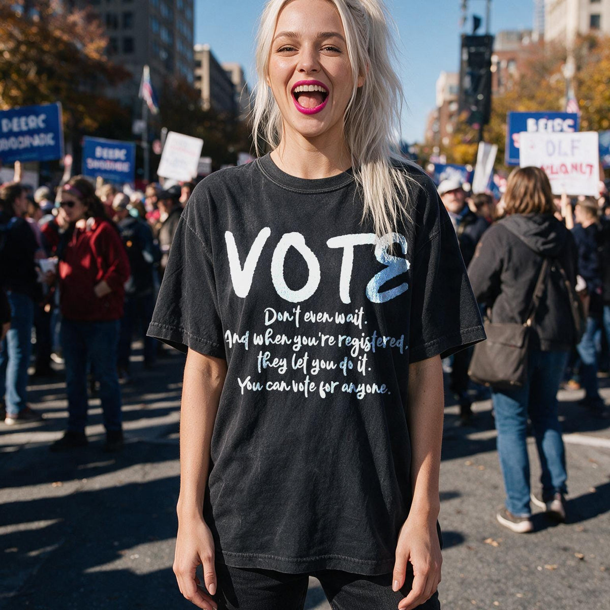 Woman in black t-shirt with &amp;quot;VOTE&amp;quot; and voting message at rally.