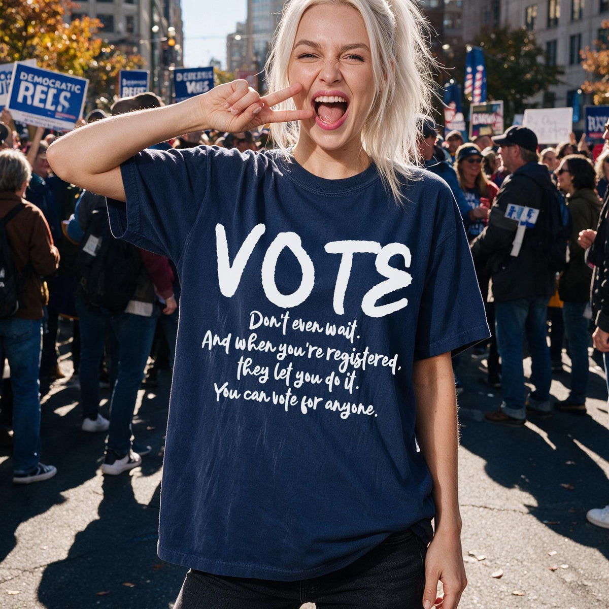 Navy blue t-shirt with white text &amp;quot;VOTE&amp;quot; and voter registration message.