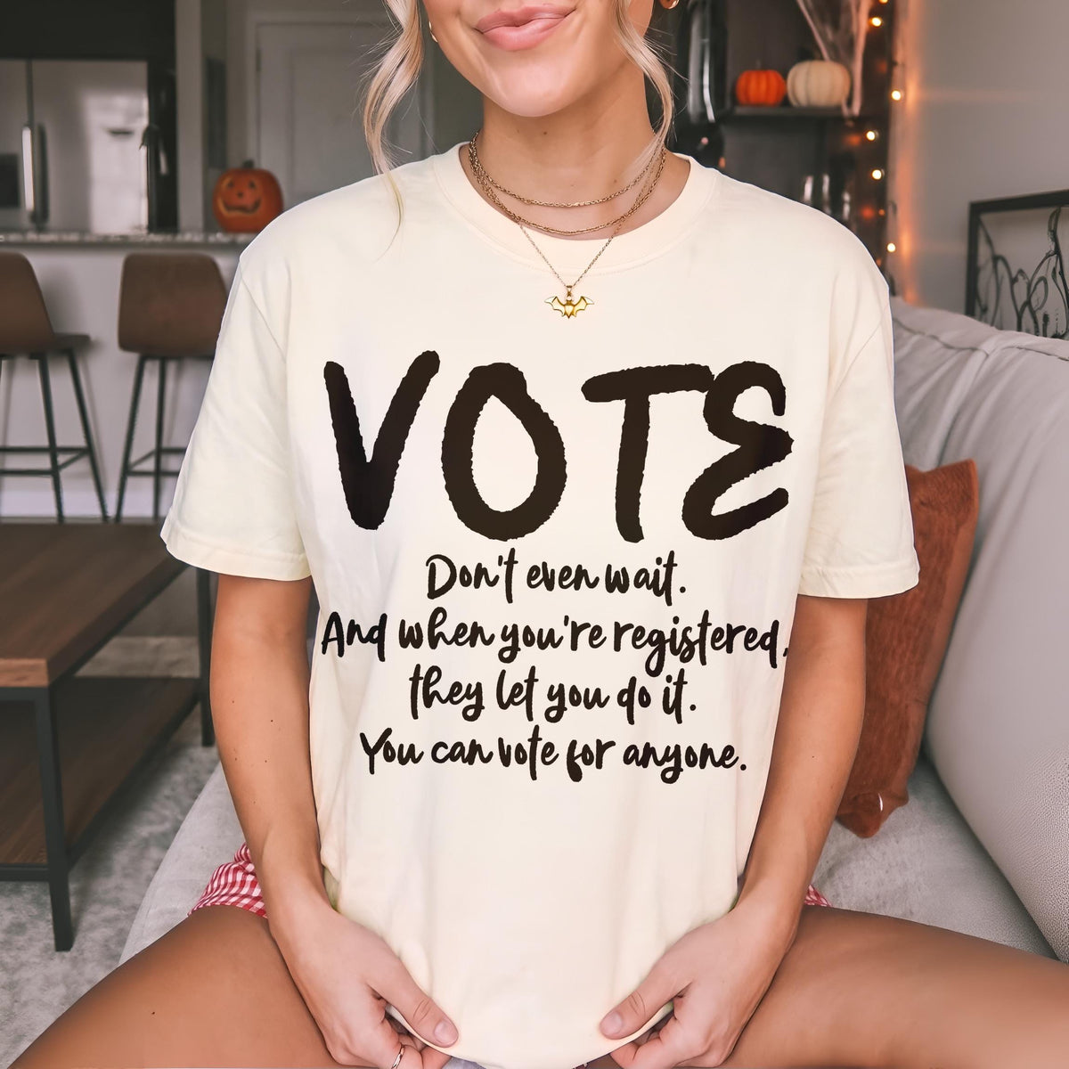Light yellow t-shirt with &amp;quot;VOTE&amp;quot; and voting rights text.