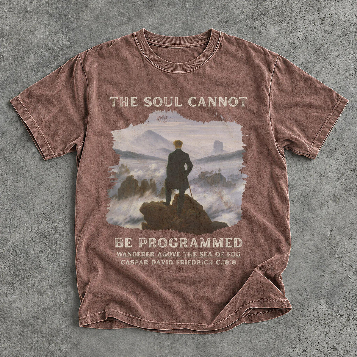 Brown t-shirt with text &amp;quot;The Soul Cannot Be Programmed&amp;quot; and artwork.