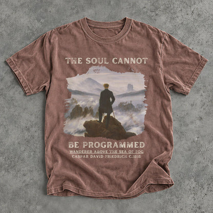 Brown t-shirt with text &amp;quot;The Soul Cannot Be Programmed&amp;quot; and artwork.