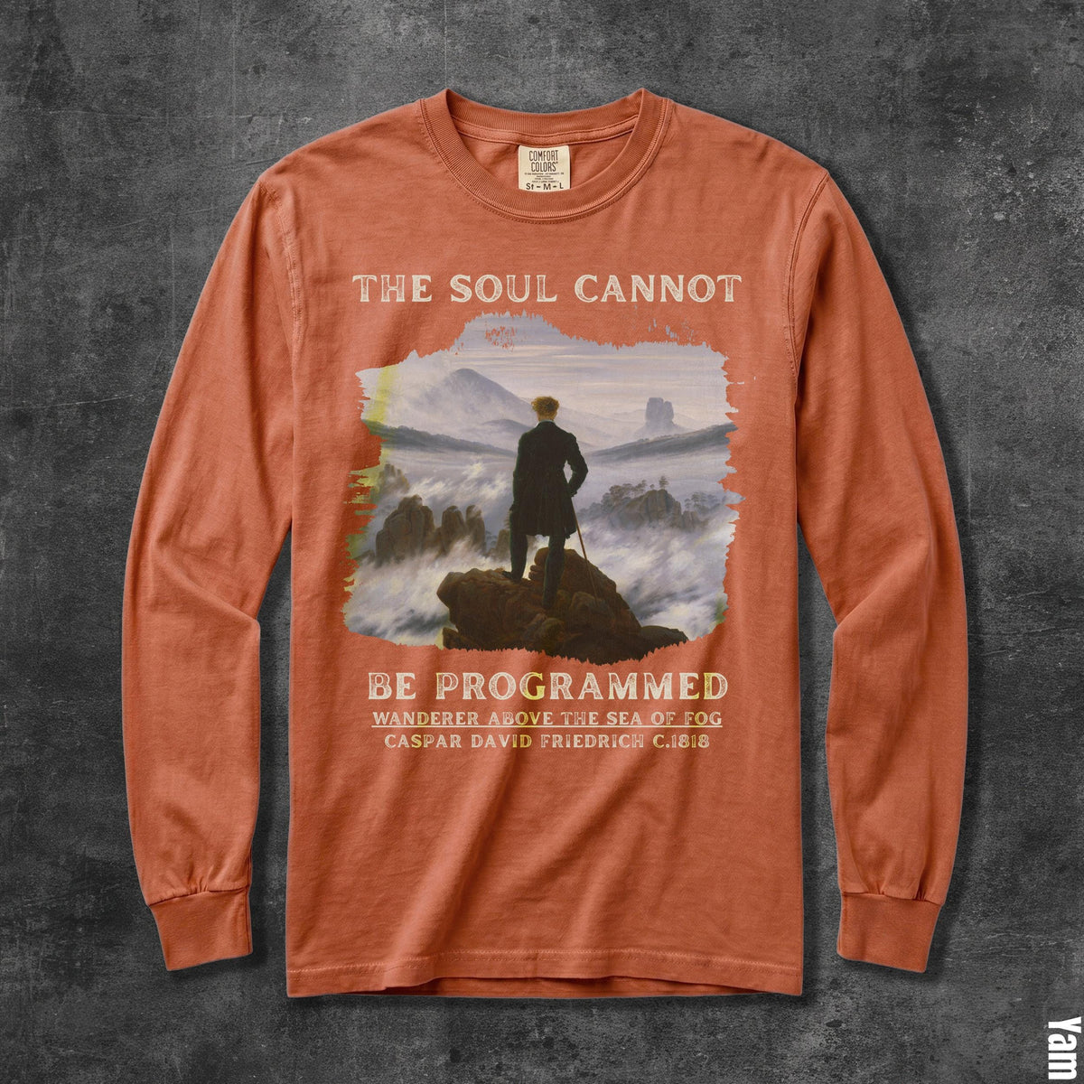 Orange long sleeve t-shirt with &amp;quot;The Soul Cannot Be Programmed&amp;quot; and painting.