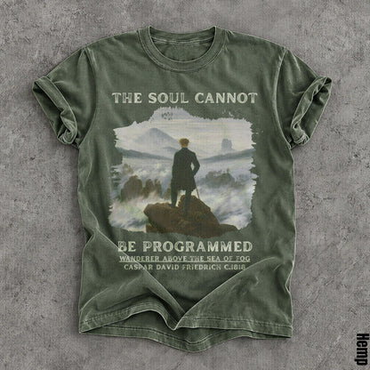 Green t-shirt with &amp;quot;The Soul Cannot Be Programmed&amp;quot; and artwork.