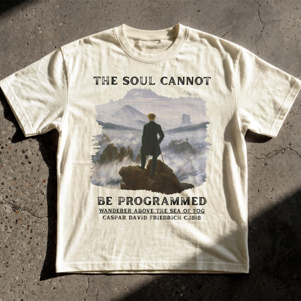 White t-shirt with &amp;quot;The Soul Cannot Be Programmed&amp;quot; and artwork.