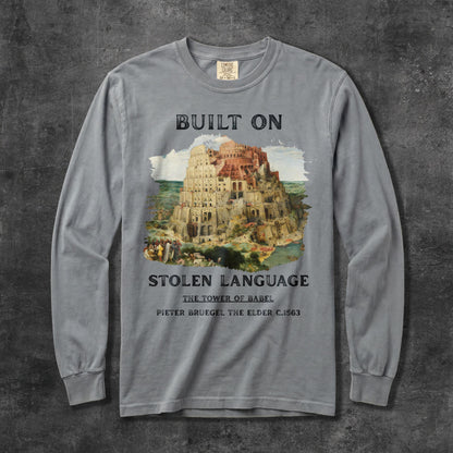 Gray long-sleeve shirt with &amp;quot;Built On Stolen Language: The Tower of Babel&amp;quot; text.