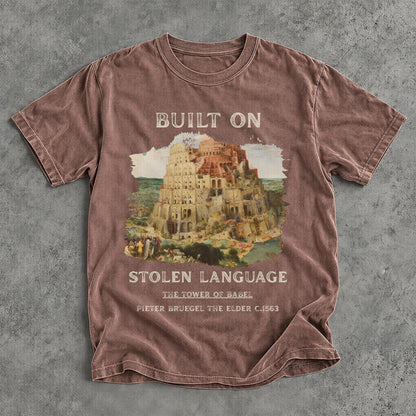 T-shirt with &amp;quot;BUILT ON STOLEN LANGUAGE&amp;quot; and Tower of Babel painting.