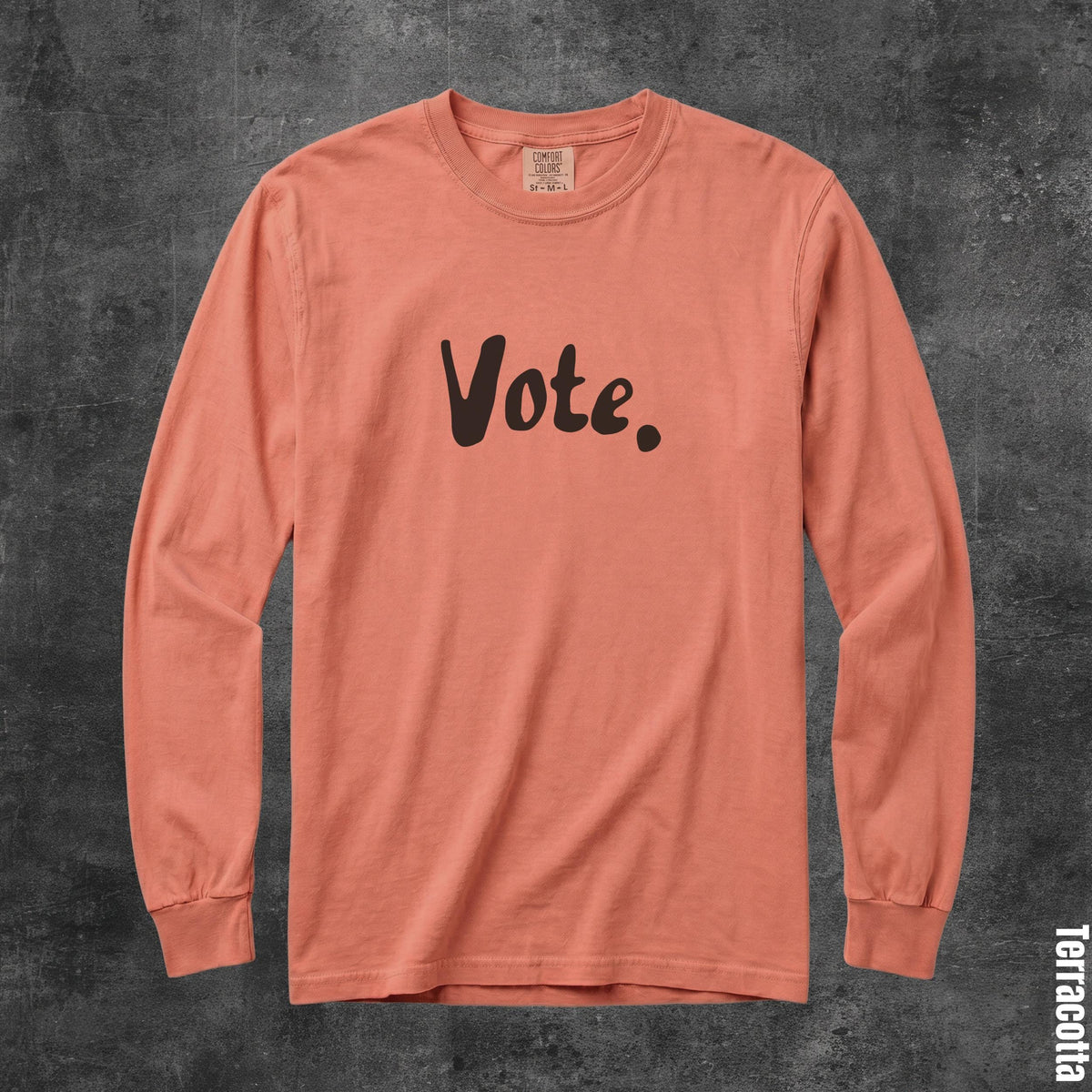 Terracotta long sleeve shirt with &amp;quot;Vote.&amp;quot; printed in brown.