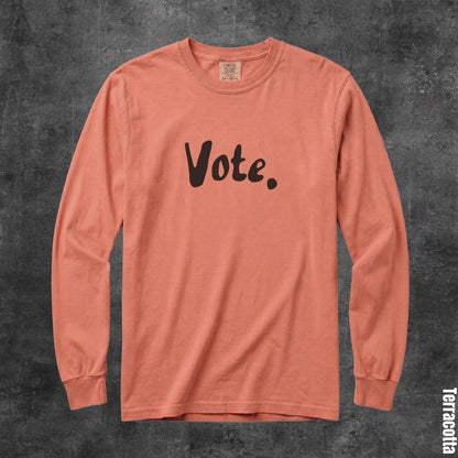 Terracotta long sleeve shirt with &amp;quot;Vote.&amp;quot; printed in brown.