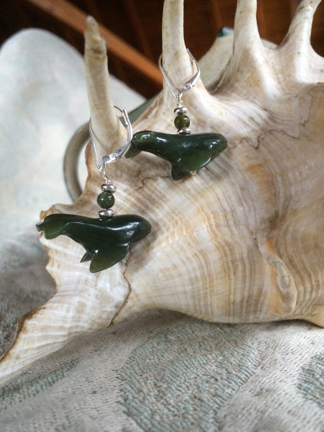 Nephrite stone jewelry featuring humpback whale earrings, a unique gift for marine life fans.