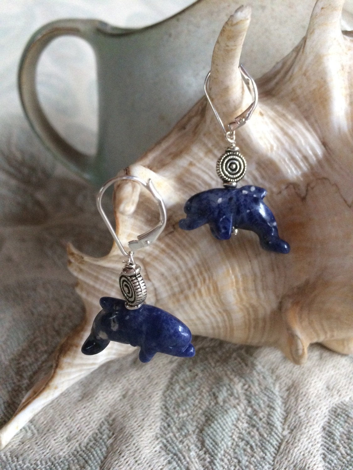 Sodalite dolphin earrings - blue dolphin jewelry showcasing carved stone dolphins; perfect for dolphin lovers.