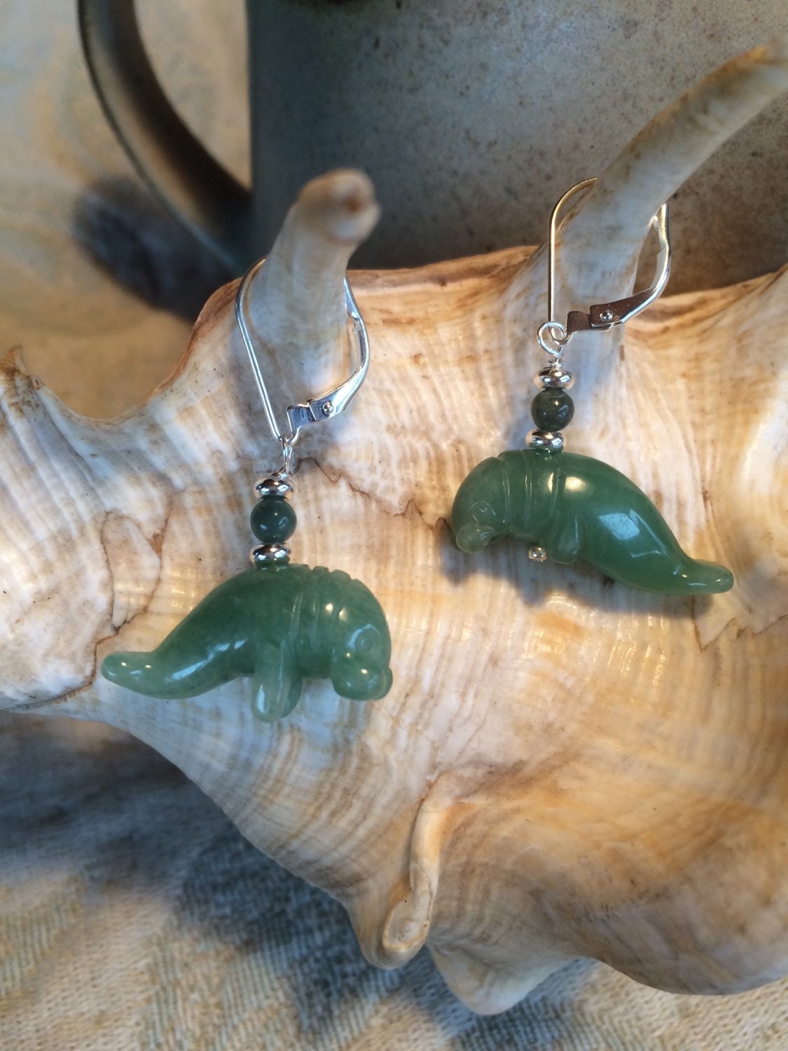 Stylish Aventurine Carved Stone Manatee Earrings displayed on a clean background, perfect for ocean theme enthusiasts and wildlife supporters.