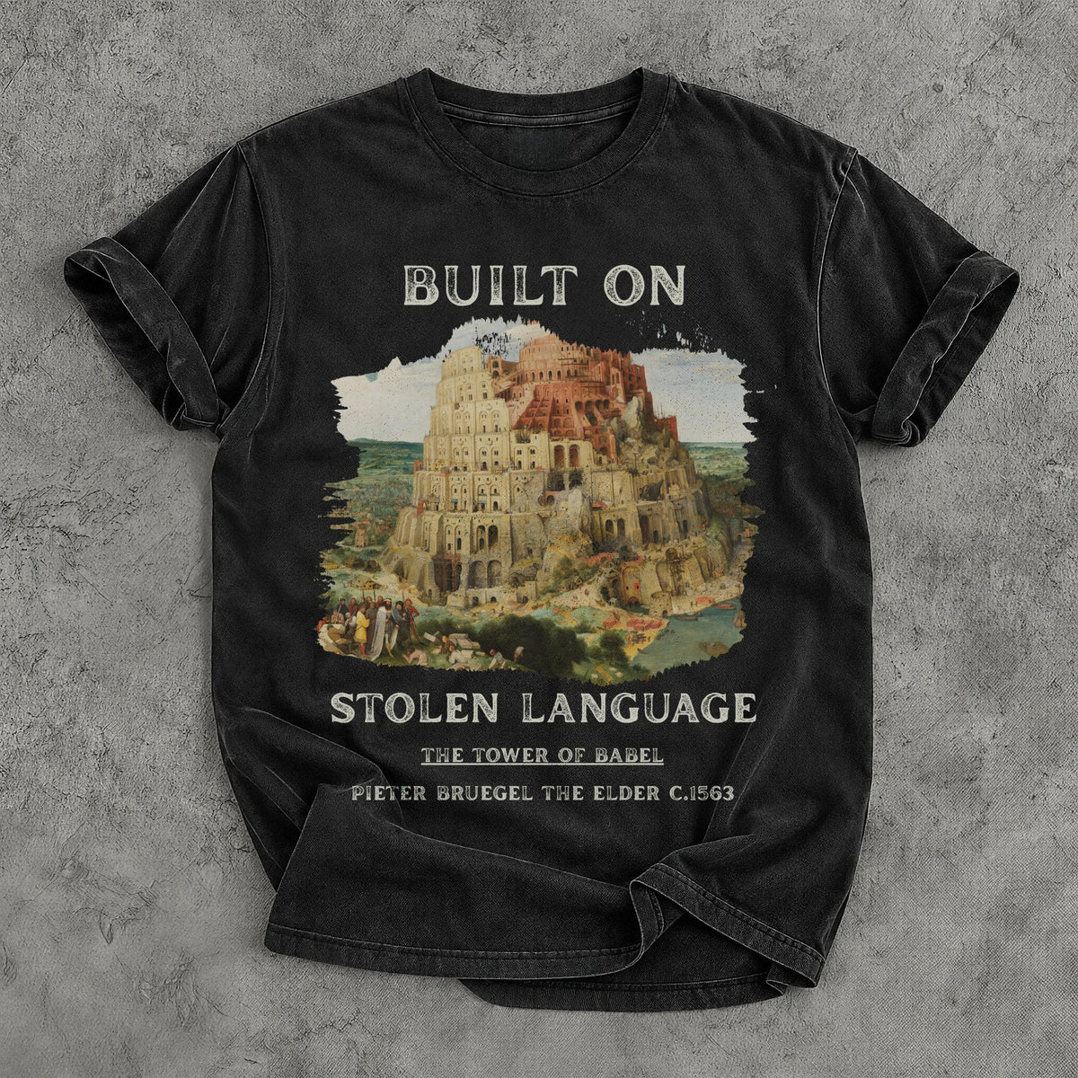 Black t-shirt with &amp;quot;Built On Stolen Language&amp;quot; and &amp;quot;The Tower of Babel&amp;quot; by Pieter Bruegel.