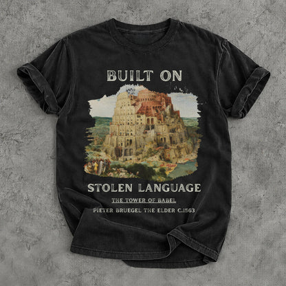 Black t-shirt with &amp;quot;Built On Stolen Language&amp;quot; and &amp;quot;The Tower of Babel&amp;quot; by Pieter Bruegel.