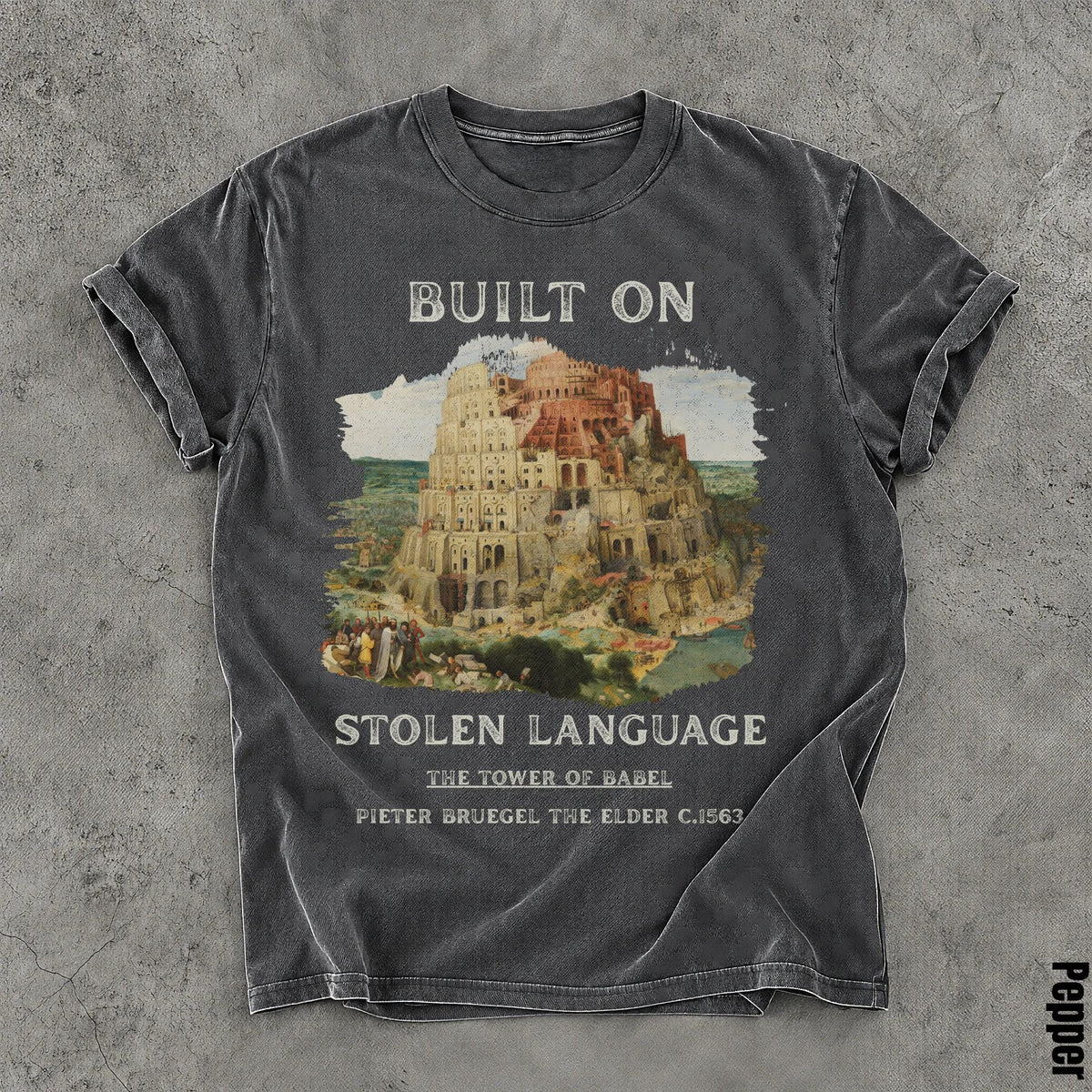 Dark gray t-shirt with Tower of Babel artwork and text &amp;quot;Built on Stolen Language.&amp;quot;
