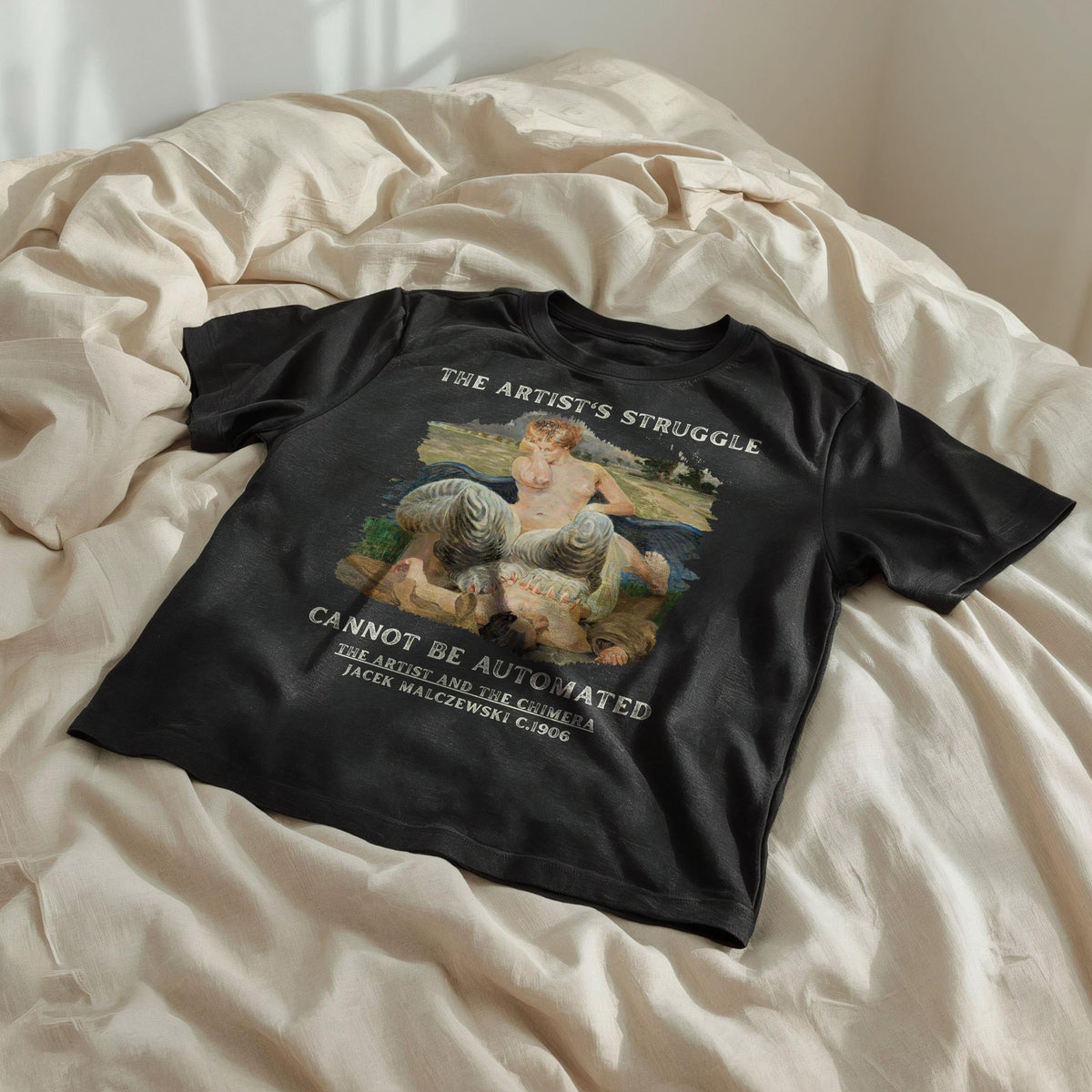 Black t-shirt with text and painting of nude figure with chimeras.