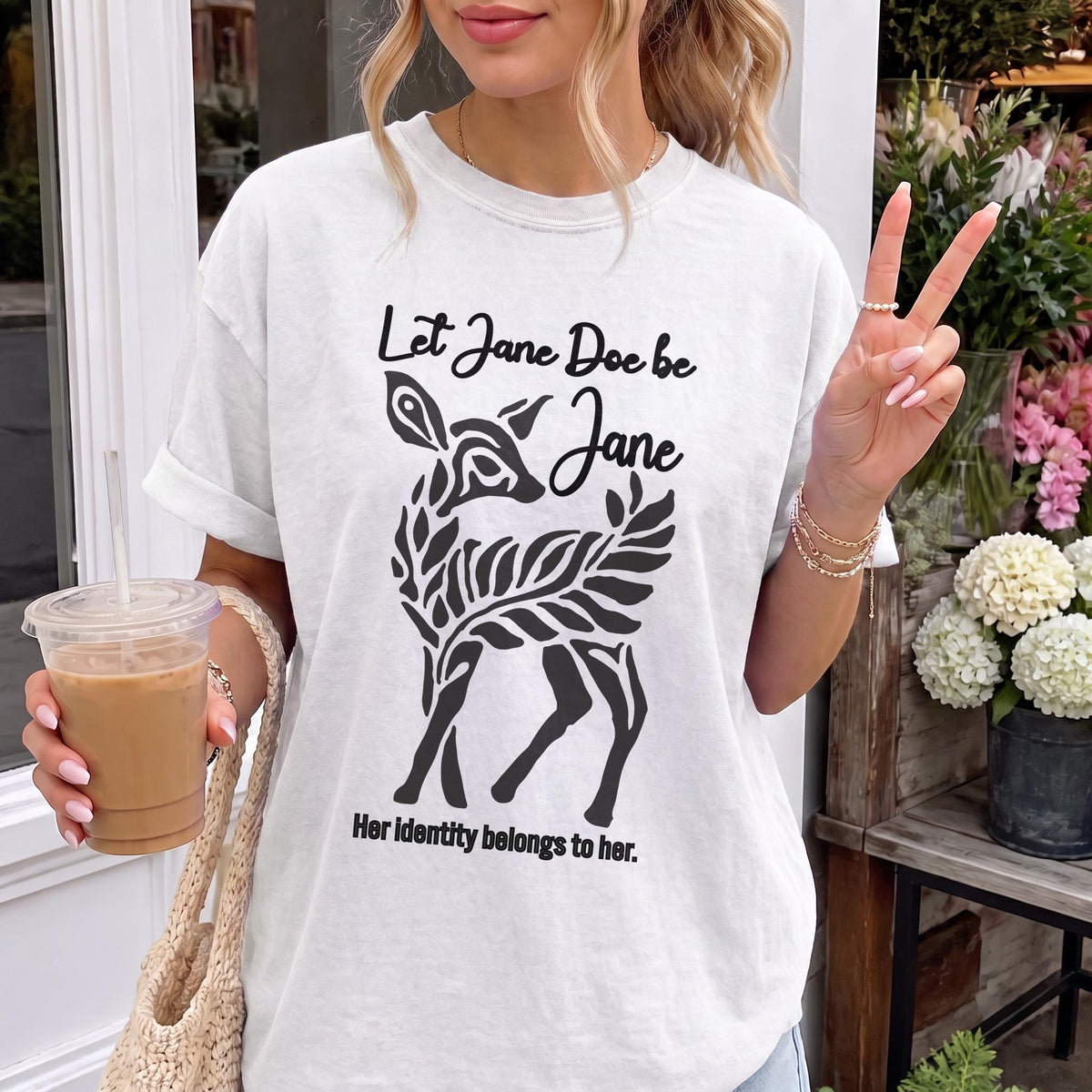 White t-shirt with black graphic of a deer and text &amp;quot;Let Jane Doe be Jane. Her identity belongs to her.&amp;quot;