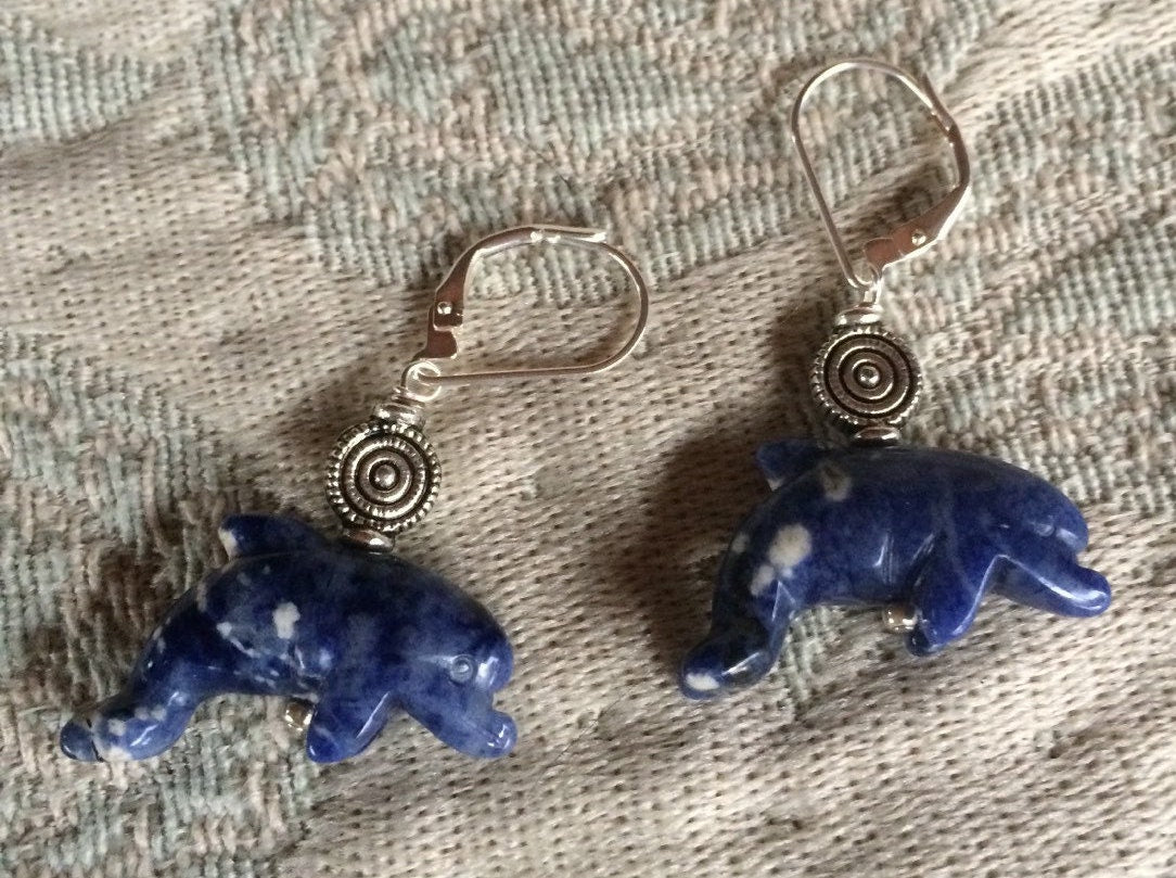 Sodalite dolphin earrings displaying blue dolphin jewelry with intricate carvings, perfect for dolphin lovers and a unique animal-themed gift.