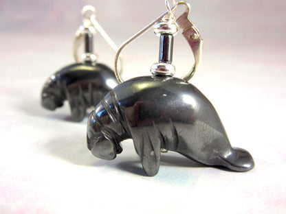 Manatee Earrings - Animal Earring, Artisan Jewelry featuring carved hematite black stone with lever-back design for dangle effect.