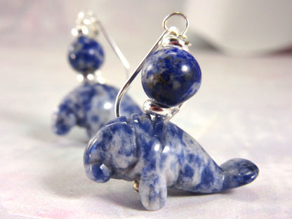 Manatee Earrings - Blue sodalite Earlobe Earrings showcasing a beautiful carved stone design, perfect for beach lovers and animal enthusiasts.