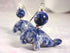 Close-up of Handmade Sodalite Manatee Leverback Earrings, showcasing blue and white marbled manatee charms with round sodalite beads, set on silver leverbacks—ideal Ocean Lover Jewelry against a soft, pale background.