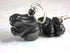 Close-up of Black Rabbit Carved Stone Bunny Earrings – White Rabbit Animal Jewelry, featuring black rabbit shapes with silver hooks and a round black bead above each. The light, blurred background highlights these unique animal-themed earrings.