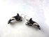 Hand Painted Ocean Themed Ceramic Whale Earrings for Animal Lovers shaped like black and white orcas with silver hooks, featuring intricate whale details, displayed on a light textured surface.