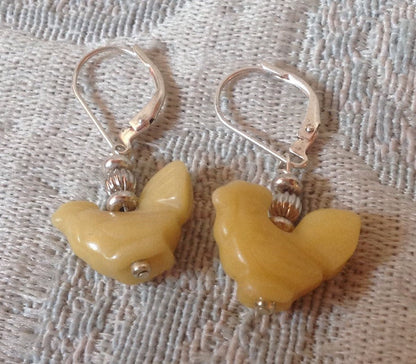 Close-up of Hand-Carved Stone Black Hen Earrings, perfect gift for barnyard keepers and egg sellers.